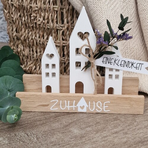 Zuhause - Lichthäuser auf Holzleiste
