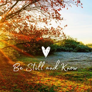 May include: A vibrant autumn landscape featuring a tree with red leaves, a grassy field, and a bright sky. The image includes the text "Be Still and Know" with a heart symbol, evoking a sense of peace and tranquility.
