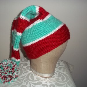 Petit lutin vert au bonnet rouge