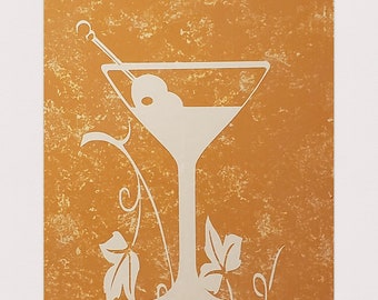 May include: A gold-colored sign with the text "Happy Hour All Day" in white lettering. A white silhouette of a martini glass with an olive is in the center of the sign.