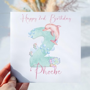 Carte d'anniversaire personnalisée dauphin rose sous la mer