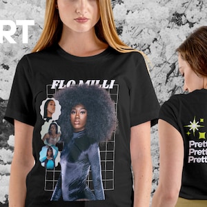 May include: Black t-shirt with a graphic print of a woman with an afro and the text "FLO MILLI". The back of the shirt has the text "Pretty Black Cute" repeated three times.