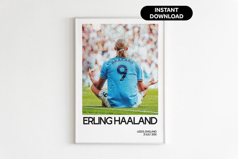 May include: A digital art print featuring a photo of a soccer player in a blue jersey with the number 9 on the back. The player is sitting in a yoga pose on a green field. The text "Erling Haaland" is printed below the photo, along with the text "Leeds, England 21 July 2000".