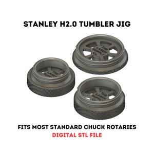 May include: 3D printed jig for a Stanley H2.0 tumbler. The jig is designed to fit most standard chuck rotaries. The jig is printed in gray plastic and has the text "The Laser Supply Co." on it. DIGITAL STL FILE.