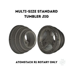 Puede incluir: Un jig impreso en 3D para un tambor rotatorio, diseñado para sujetar tambores de varios tamaños. El jig está etiquetado como "10-20-30-40oz Tumbler Jig" y "ATOMSTACK R1".