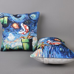 May include: Two decorative throw pillows with a blue, green, and red print inspired by the famous Starry Night painting by Vincent van Gogh. The print features a video game character and a pipe.