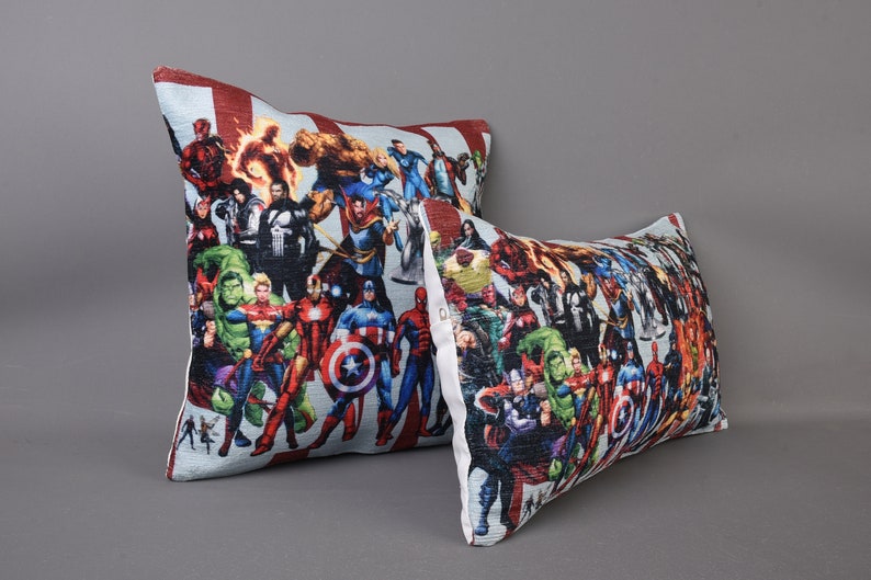 May include: Two decorative throw pillows with a colorful print of various superheroes. The pillows are made of a soft, comfortable fabric and feature a zipper closure.