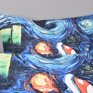 May include: Two blue and black throw pillows with a swirling, abstract pattern reminiscent of a famous painting. The pattern includes green, orange, and red accents.