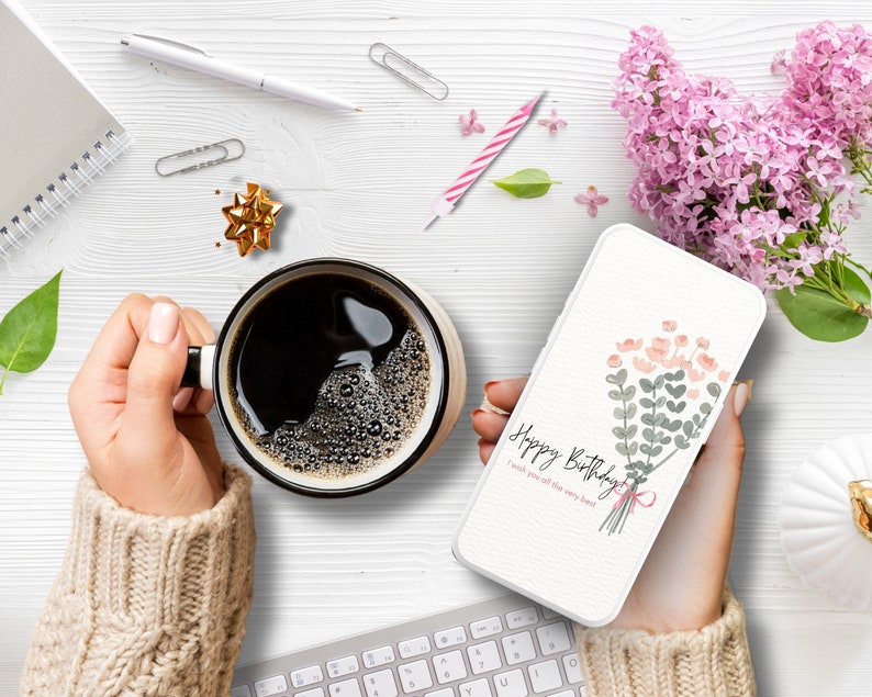 May include: A white phone case with a watercolor design of a bouquet of pink and green flowers. The text "Happy Birthday" and "I wish you all the very best" is printed on the case.