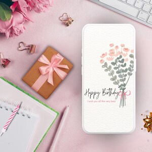May include: A white phone case with a pink and green floral design and the text "Happy Birthday! I wish you all the very best!"