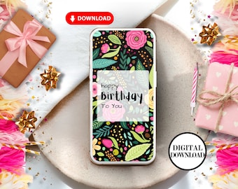 May include: A digital phone wallpaper with a floral pattern in pink, green, and yellow on a black background. The text "happy birthday to you" is in a white box on the phone screen.