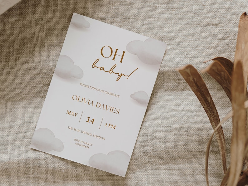 May include: A white baby shower invitation with a brown text overlay. The text reads "OH baby!" and includes the details of the event: Olivia Davies, May 14, 1 PM, The Rose Lounge, London. RSVP to Molly, 07712345678.