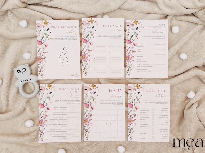 Op de afbeelding: Een set met printbare babyborrelspelkaarten met een bloemenontwerp. De kaarten bevatten spellen zoals "How Big is Her Belly", "Baby Name Game", "Predictions and Advice", "Who Knows Mommy Best", "Baby Bingo" en "Would She Rather".