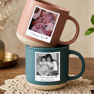 May include: A set of three ceramic mugs with a speckled, matte finish. The mugs are in shades of cream, light gray, and dark gray. Each mug has a simple, minimalist design, perfect for coffee or tea.