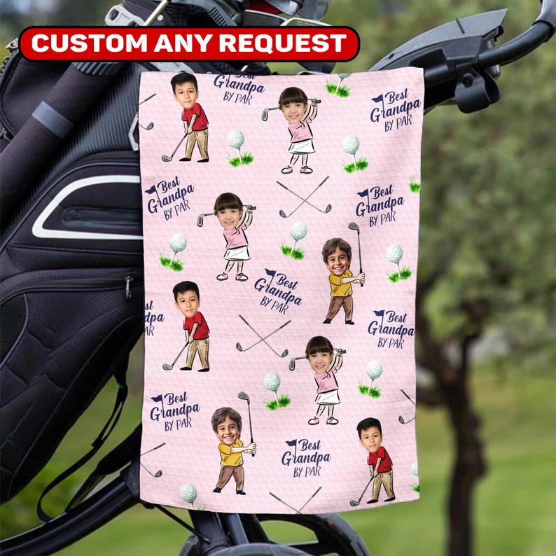 May include: A pink golf towel featuring a repeating pattern of cartoon children playing golf, golf balls, and crossed golf clubs. The text "Best Grandpa BY PAR" and "CUSTOM ANY REQUEST" are also visible.