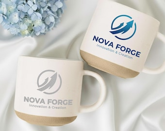 May include: Two white ceramic mugs with a beige base and handle. Each mug features the "NOVA FORGE" logo with an arrow design. The text "Innovation & Creation" is below the logo. The phrase "CUSTOM YOUR LOGO" is at the bottom.