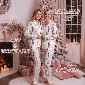 May include: White pajama set with a festive print of nutcrackers, Christmas trees, and ballerinas. The set includes a button-down top and matching pants. Text on the image reads "PAJAMAS SET", "SOFT & BREATHABLE", and "S-5XL".