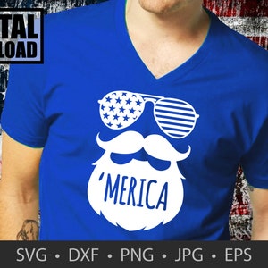 May include: A blue t-shirt with a white design of a beard, moustache, and sunglasses. The sunglasses have an American flag pattern. The text 'MERICA' is written on the beard.