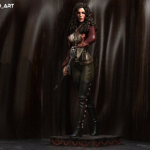 May include: A female figure in a dark red jacket, black pants, and tall black boots with silver accents. She is holding a staff with a silver skull handle. The figure is standing on a platform with a dark brown background.