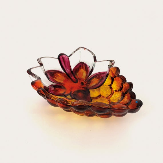 Dish in the shape of a bunch of orange and red grapes