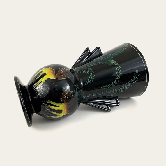 Large black enameled vase with fawn and plant motifs, blue interior