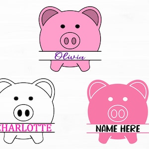 Könnte beinhalten: Ein rosa Sparschwein mit einer weißen Linie in der Mitte und dem Namen "Olivia" in Lila auf der weißen Linie. Es gibt zwei weitere Sparschweine, eines weiß und eines rosa, mit den Namen "CHARLOTTE" und "NAME HERE" auf den weißen Linien.