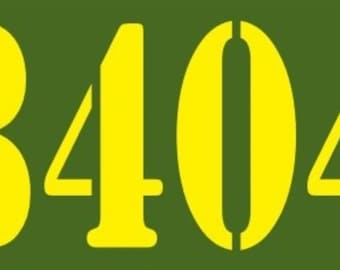May include: A close-up of a yellow number 8404 on a green background.