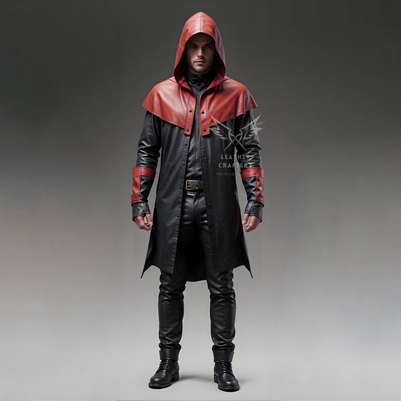 May include: A black leather trench coat with a red leather hood and accents. The coat has a long length and a fitted silhouette. The model is wearing black pants and boots.