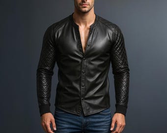 May include: A black leather shirt with a mandarin collar and button-down front. The long sleeves feature quilted detailing on the shoulders and upper arms, with ribbed cuffs. The shirt is paired with blue jeans.