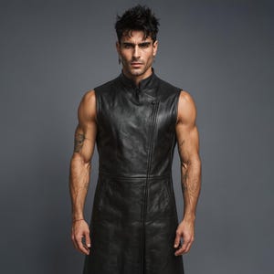 May include: A sleeveless, black leather vest with a high collar and asymmetrical button closure. The vest is long, extending to the mid-thigh. The leather appears to be smooth and has a slight sheen. The overall style is modern and edgy.