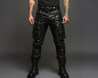 May include: Black leather pants with multiple pockets, zippers, and a belt. The pants have a fitted design and are paired with black boots. The image is taken against a gray background.