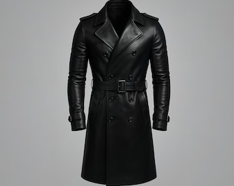 May include: A black leather trench coat with a double-breasted design. The coat features a belt at the waist, a notched collar, and buttoned cuffs. The coat is approximately 127 cm long.