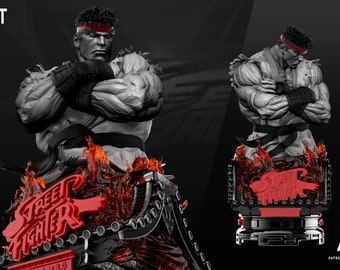May include: A gray and white bust of a Street Fighter character with a red headband. The bust is set on a black base with a red "Street Fighter" logo and flames.