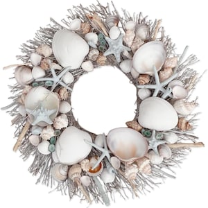 May include: A white and beige wreath decorated with seashells and starfish. The wreath is made of twigs and has a rustic look.