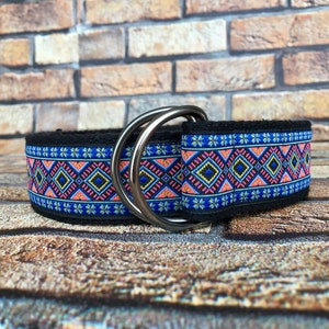 May include: A black dog collar with a colorful geometric pattern and silver double D-rings.