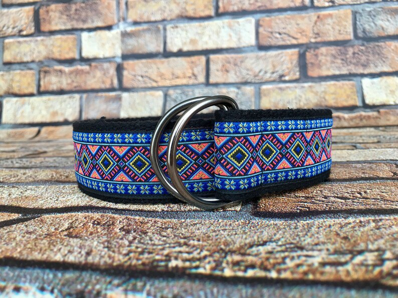 May include: A black dog collar with a colorful geometric pattern and silver double D-rings.