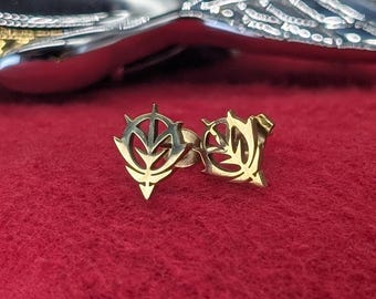 Zeon Insignia-oorbellen bezaaid goud en zilver Gundam geïnspireerd