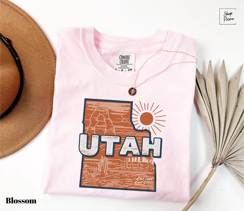 a pink shirt with the word utah printed on it