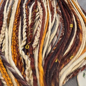 Blonde with cowboy copper accents double ended dreads