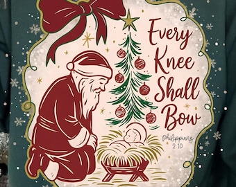 Sublimación PNG "Toda rodilla se doblará", Escena de la Natividad, Papá Noel navideño, Camiseta navideña, Papá Noel arrodillado, Niño Jesús