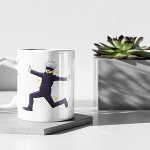 May include: White ceramic mug with a colorful illustration of an anime character running with a determined expression. The character has white hair, a black mask, and is wearing a black and white outfit.