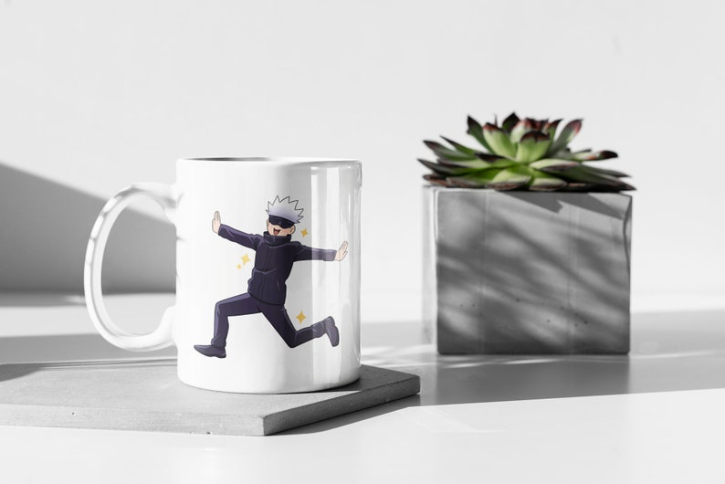 May include: White ceramic mug with a colorful illustration of an anime character running with a determined expression. The character has white hair, a black mask, and is wearing a black and white outfit.