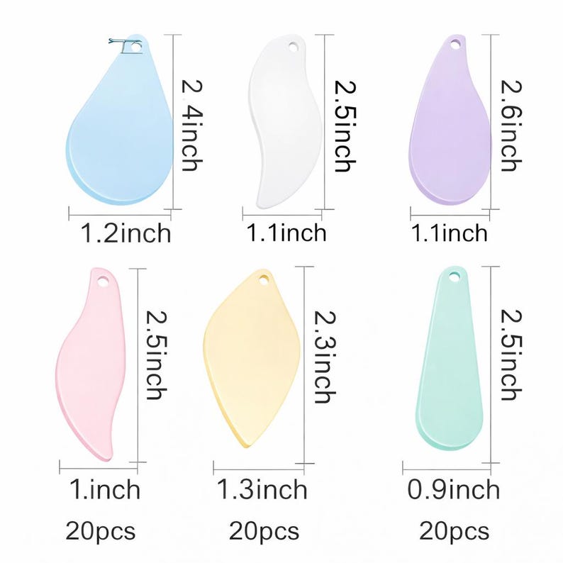 May include: A collection of six cosmetic spatulas in pastel shades: blue, white, lilac, pink, yellow, and mint green. Each spatula is approximately 6.1 to 6.6 cm long and 2.3 to 3.3 cm wide. The set includes various shapes.