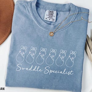 Swaddle Specialist Shirt, Comfort Colors® Labor And Delivery Nurse Tee, Nicu Nurse Gift, Mother Baby Nurse Top, Neonatal Icu Nurse Shirt