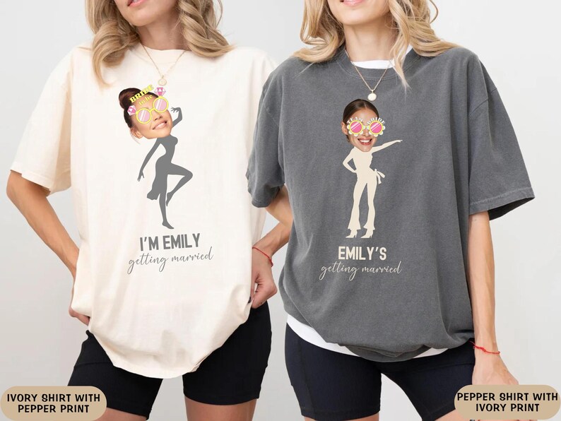 May include: Two ivory and pepper t-shirts with a graphic of a woman dancing and the text "I'm Emily getting married" and "Emily's getting married".