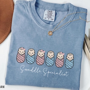 Swaddle Specialist Shirt, Comfort Colors® Labor And Delivery Nurse Tee, Nicu Nurse Gift, Mother Baby Nurse Top, Neonatal Icu Nurse Shirt