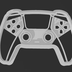 May include: A light gray controller with a modern design, featuring buttons, directional pad, and analog sticks. The controller's outline is visible against a dark background, suggesting a gaming theme.