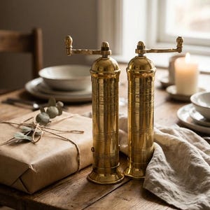 lifestyle shot of brass salt pepper mill set