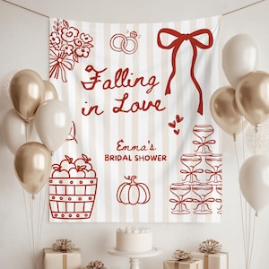 Op de afbeelding: Een vrijgezellenfeestscène met een achtergrond met de tekst "Falling in Love" en "Emma's Bridal Shower". De achtergrond heeft een gestreept patroon en rode illustraties. Ballonnen, cadeaus, een taart en champagneglazen zijn ook aanwezig.