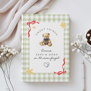 May include: A notebook with a green and white gingham pattern. The cover features a teddy bear illustration with the text "Sweet Things" and "Emma Says & Does so I'll never forget". Red ribbon and yellow flower accents decorate the cover.